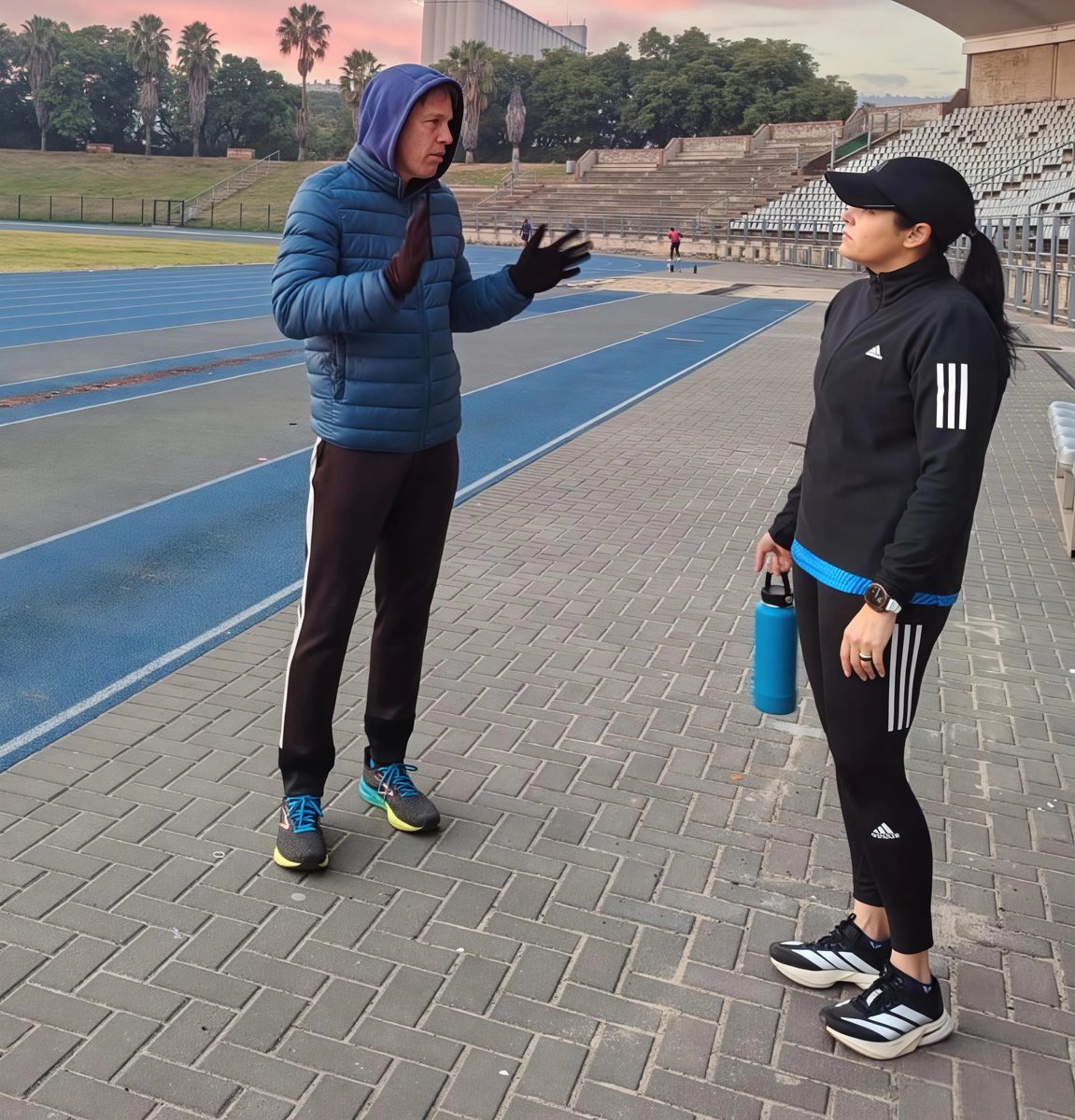 Coach Clint giving track-side coaching guidance